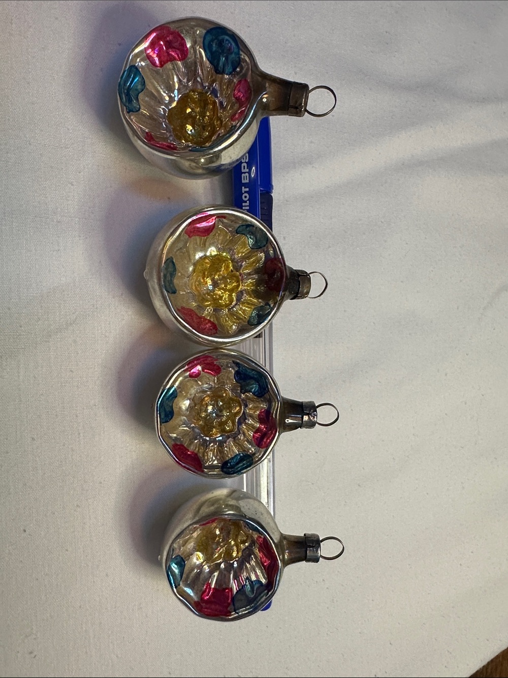 Group of four vintage mini indent Christmas  ornaments
